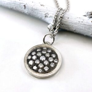 Silver diamond disc pendant necklace