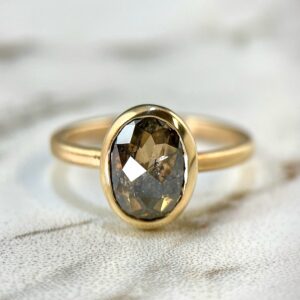 Oval black diamond bezel ring