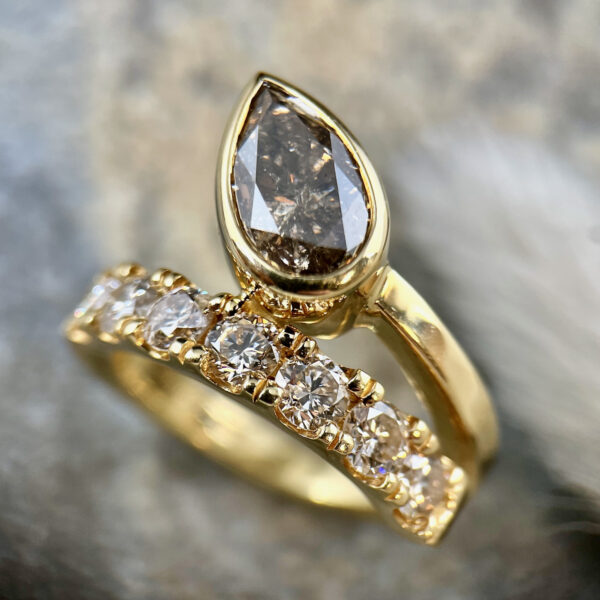 Pear diamond by-pass ring