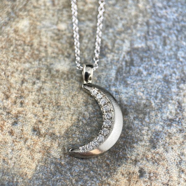 Moon pendant necklace with diamonds