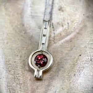 Red/orange sapphire pendant