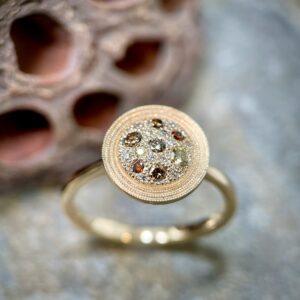Gold disc ring with diamonds