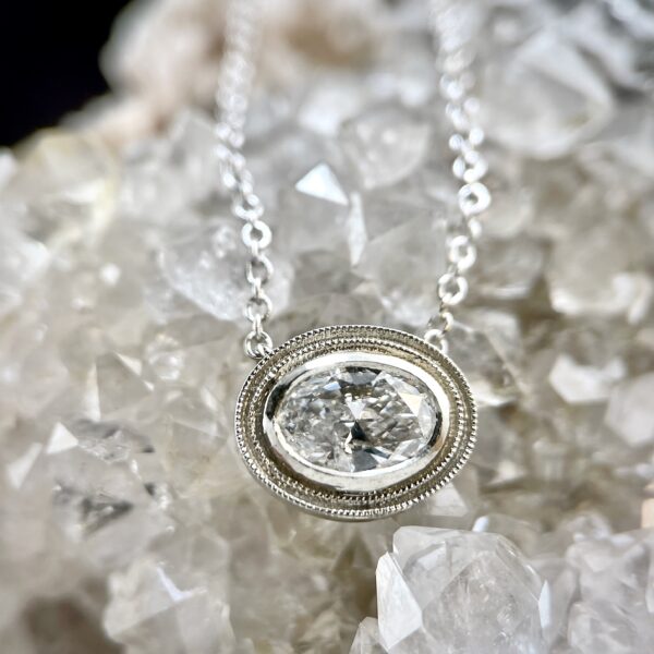 Oval diamond halo necklace