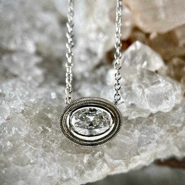 Oval diamond halo necklace